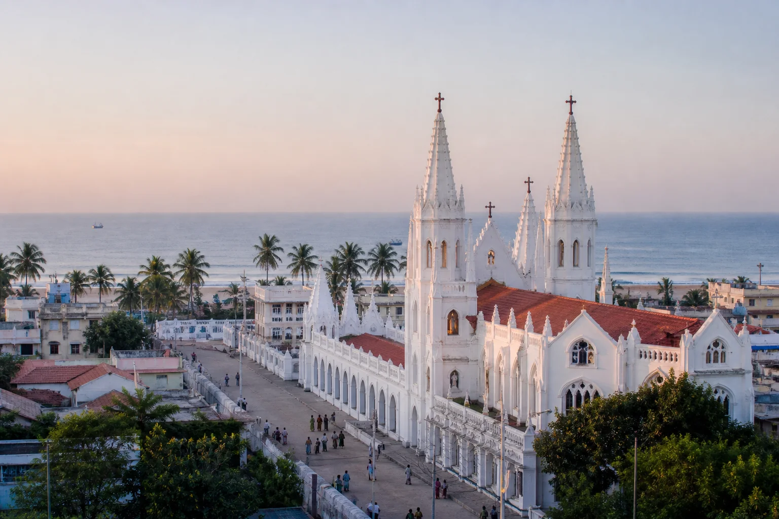 Editorial interpretation of Velankanni's white basilica complex beside the Bay of Bengal